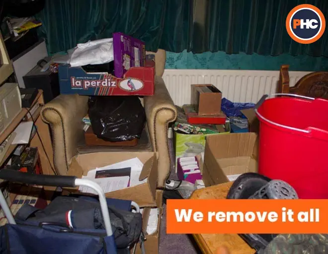 room full with clutter unwanted rubbish waste and furniture
